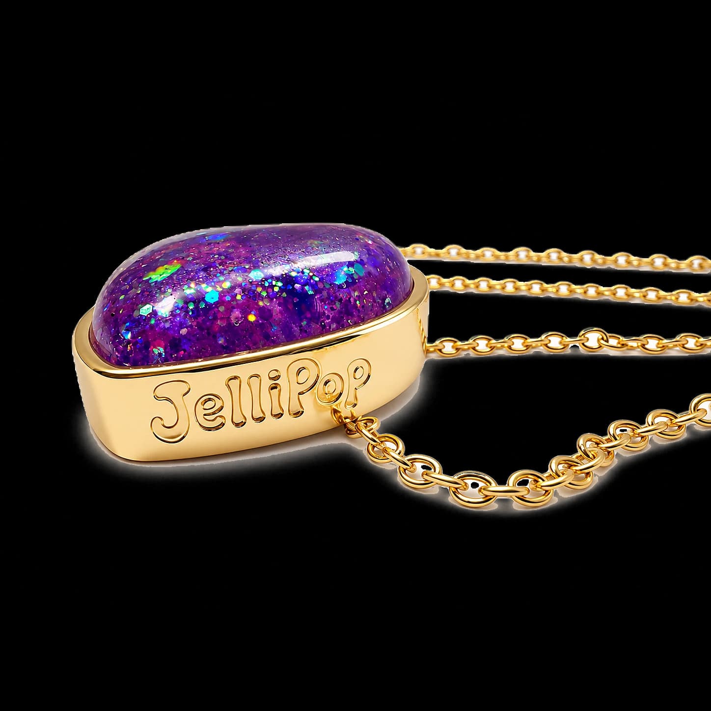 Violet Dream pendant on its side, JelliPop embossed along the bezel