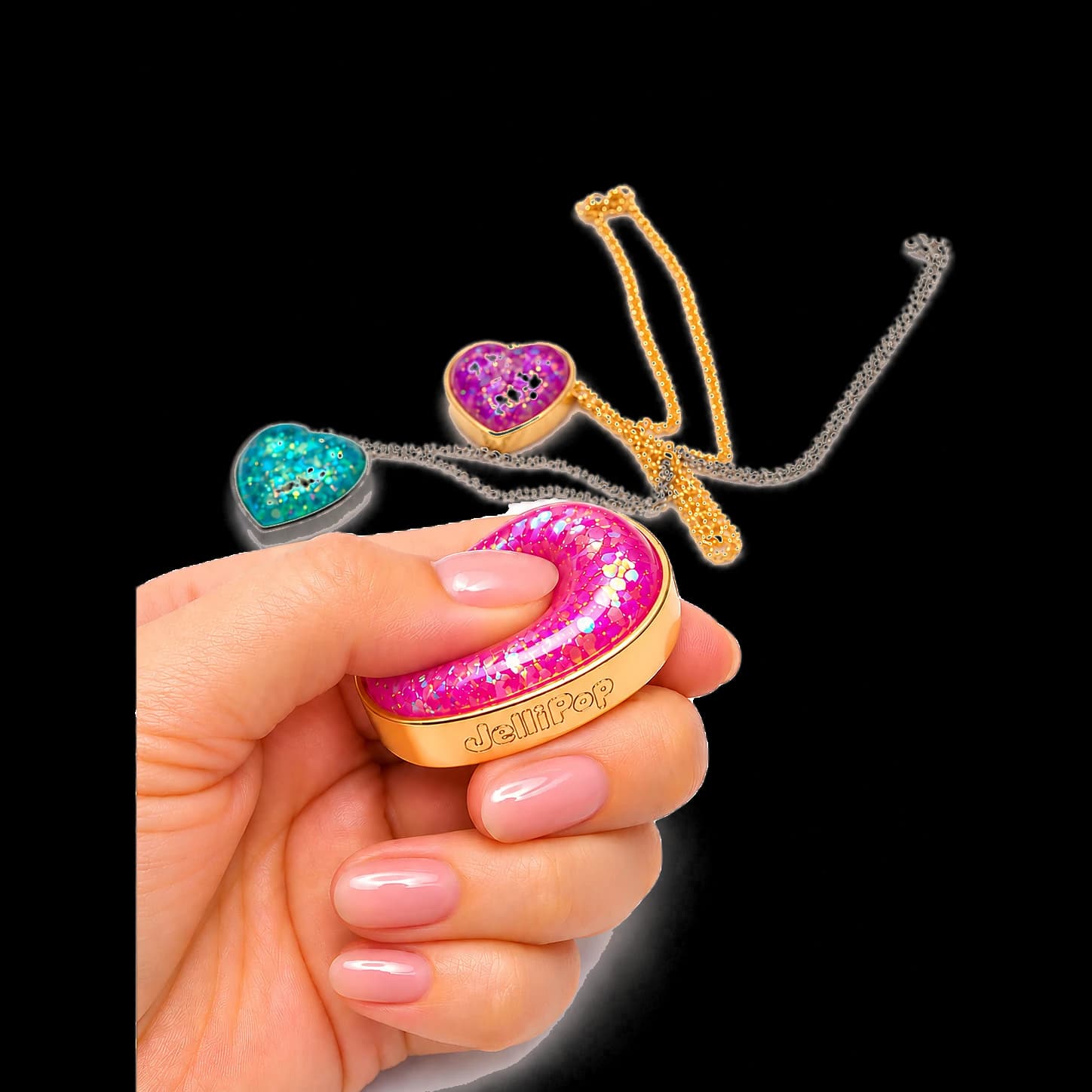 A hand squeezing the Bubblegum Pink pendant